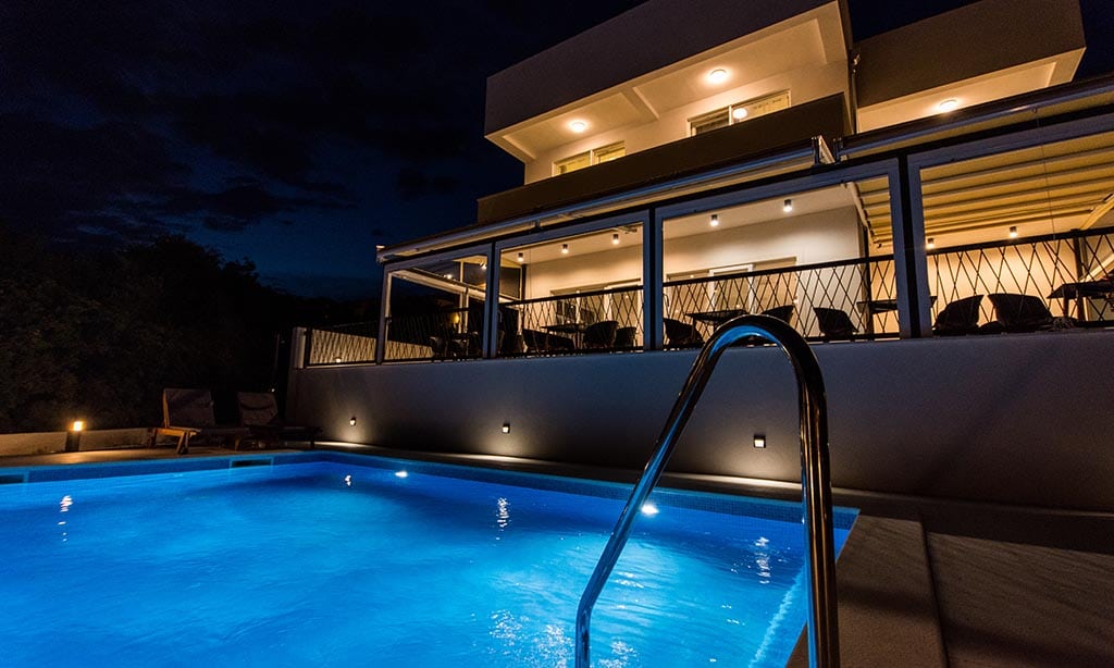 Villa Casablanca pool illuminated at night